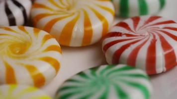 Rotating shot of a colorful mix of various hard candies - CANDY MIXED 027
