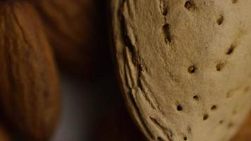 Cinematic, rotating shot of almonds on a white surface - ALMONDS 175 video