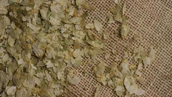 Rotating shot of barley and other beer brewing ingredients - BEER BREWING 289 video