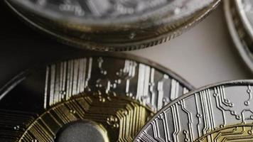 Rotating shot of Bitcoins digital cryptocurrency - BITCOIN RIPPLE 0067 video