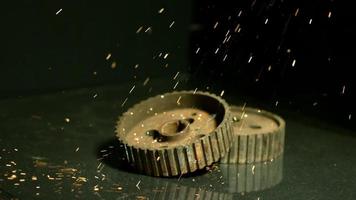 Sparks with gears in ultra slow motion 1,500 fps on a reflective surface - SPARKS w GEARS 005 video