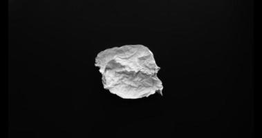 Crumpled white paper stop motion video