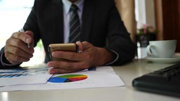 Businessman hands doing analysis planning business project in office. video