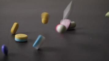 Slow-motion of Pills falling on a table video