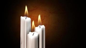 Three White Candles Burn in front of a Stone Wall video