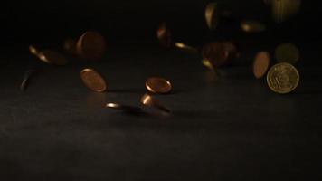 A group of coins falling down on a table video