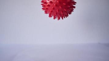 Red Ball is Mock-up that Looks with a Virus Cell on White Background. video