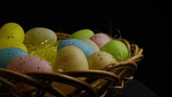 Rotating shot of Easter decorations and candy in colorful Easter grass - EASTER 044 video