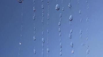 Flowing Water Droplets on Glass video