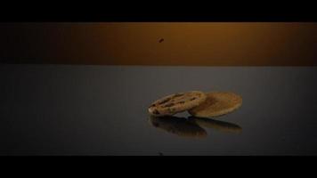 Falling cookies from above onto a reflective surface - COOKIES 238 video