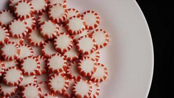 Rotating shot of peppermint candies - CANDY PEPPERMINT 049 video