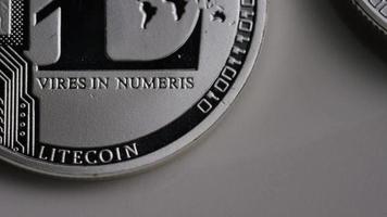 Rotating shot of Litecoin Bitcoins (digital cryptocurrency) - BITCOIN LITECOIN 0111