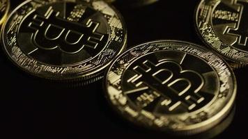 Rotating shot of Bitcoins digital cryptocurrency - BITCOIN 0474 video