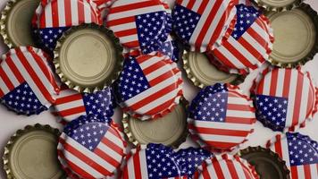 Rotating shot of bottle caps with the American flag printed on them - BOTTLE CAPS 022 video