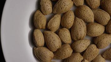 Cinematic, rotating shot of almonds on a white surface - ALMONDS 045