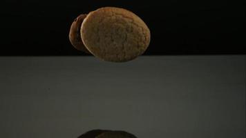 Cookies falling and bouncing in ultra slow motion (1,500 fps) on a reflective surface - COOKIES PHANTOM 132 video