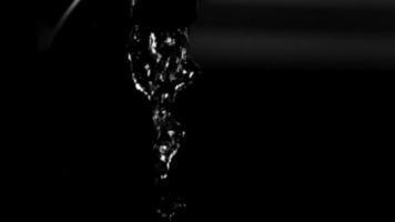 Water pouring from a faucet in ultra slow motion 1,500 fps on a reflective surface - WATER FAUCET 005 video