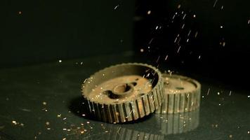 Sparks with gears in ultra slow motion 1,500 fps on a reflective surface - SPARKS w GEARS 004 video