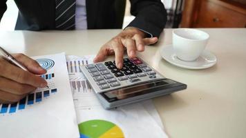 Businessman hands doing analysis planning business project in office. video