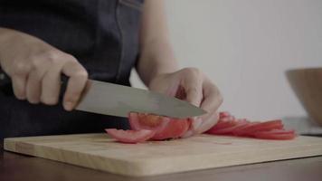 Chef chopping a tomato  video