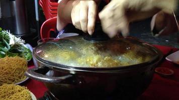 Chinese hot pot being uncovered video