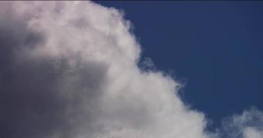 Time lapse of a close up to a cumulus cloud crossing the scene from left to right in 4K