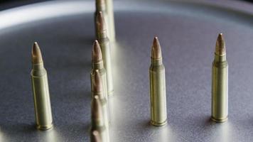 Cinematic rotating shot of bullets on a metallic surface - BULLETS 067 video