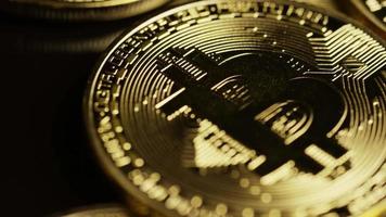 Rotating shot of Bitcoins (digital cryptocurrency) - BITCOIN 0095