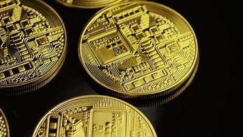 Rotating shot of Bitcoins (digital cryptocurrency) - BITCOIN 0062