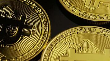 Rotating shot of Bitcoins (digital cryptocurrency) - BITCOIN 0024
