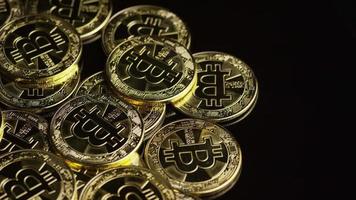 Rotating shot of Bitcoins (digital cryptocurrency) - BITCOIN 0543