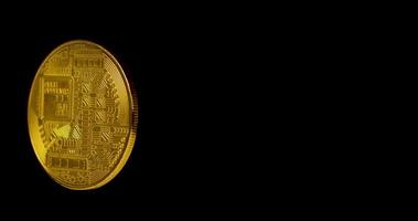 Rotating Gold Bitcoin on a black background. video