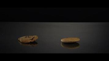 Falling cookies from above onto a reflective surface - COOKIES 241