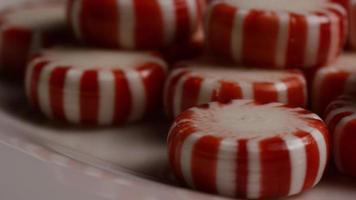 Rotating shot of peppermint candies - CANDY PEPPERMINT 072 video