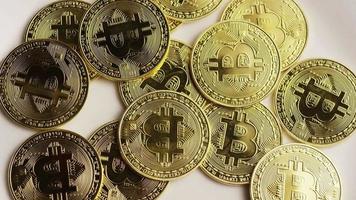 Rotating shot of Bitcoins (digital cryptocurrency) - BITCOIN 0163