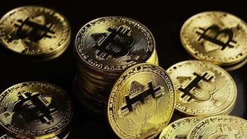 Rotating shot of Bitcoins (digital cryptocurrency) - BITCOIN 0104