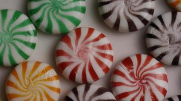 Rotating shot of a colorful mix of various hard candies - CANDY MIXED 008 video