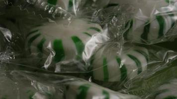 Rotating shot of spearmint hard candies - CANDY SPEARMINT 011 video
