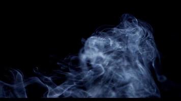 Awesome smoke moving plasma in the lower section of thye scene on dark background in 4K video