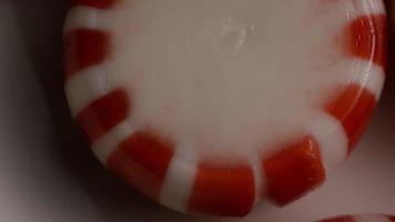 Rotating shot of peppermint candies - CANDY PEPPERMINT 025 video