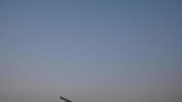 Boy running in a field and playing with a toy wooden airplane in his hands at sunset video