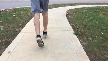 Runner Running On A Curved Sidewalk video