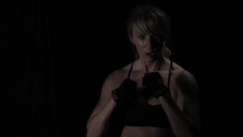 Female boxer doing shadow boxing