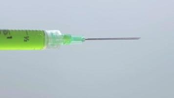 Close Up Of Syringe Dripping Green Liquid video