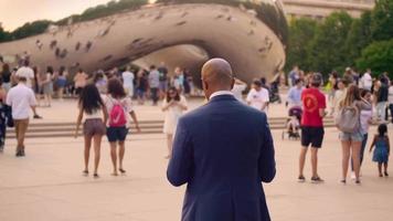 People Walking Next To The Bean In Chicago