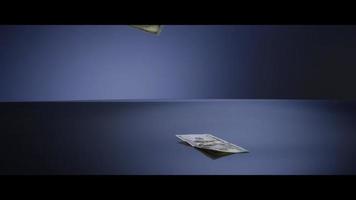 American 100 Bills Falling onto a Reflective Surface - MONEY 0016 video