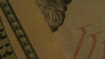 Rotating stock footage shot of American paper currency on an American eagle shield background - MONEY 0440 video