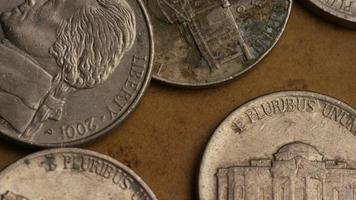 Rotating stock footage shot of American nickles coin - 0.05 - MONEY 0201 video