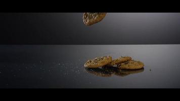 Falling cookies from above onto a reflective surface - COOKIES 193