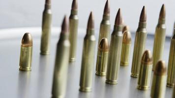 Cinematic rotating shot of bullets on a metallic surface - BULLETS 077 video